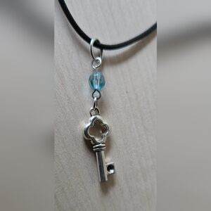 Silver Key Pendant Necklace with Blue Accent